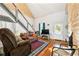 Bright open living space featuring hardwood floors, a tall ceiling, and natural light at 5150 Wheat Ne St, Covington, GA 30014