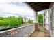 Balcony overlooking green trees and a parking lot at 1965 Nocturne Dr # 1306A, Alpharetta, GA 30009