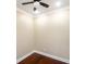 A bedroom features hardwood floors, a ceiling fan, and neutral walls at 1965 Nocturne Dr # 1306A, Alpharetta, GA 30009