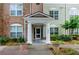 Building entrance with columns and landscaping at 1965 Nocturne Dr # 1306A, Alpharetta, GA 30009