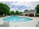 A community in-ground pool, pool house and gazebo in a parklike setting with lounge chairs at 1965 Nocturne Dr # 1306A, Alpharetta, GA 30009