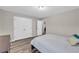 Bright bedroom with double closets and contemporary accents at 502 Stoneland Pl, Lawrenceville, GA 30046
