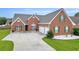 A classic brick home featuring an attached two-car garage at 502 Stoneland Pl, Lawrenceville, GA 30046
