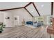 Open-concept living room with vaulted ceiling and wood beams at 502 Stoneland Pl, Lawrenceville, GA 30046