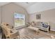 Bright living room with vaulted ceiling and large window at 502 Stoneland Pl, Lawrenceville, GA 30046