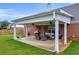 Covered patio with a seating area and ceiling fans offering a relaxing outdoor space at 502 Stoneland Pl, Lawrenceville, GA 30046