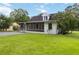 Charming home with a screened-in porch and well-maintained lawn and drive at 8185 Rivertown Rd, Fairburn, GA 30213