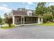 Charming home with a screened-in porch and well-maintained lawn and drive at 8185 Rivertown Rd, Fairburn, GA 30213