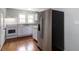 Modern kitchen with granite countertops, white cabinetry, and stainless steel appliances, blending style and functionality at 8185 Rivertown Rd, Fairburn, GA 30213