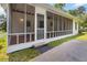 Enclosed screened-in porch perfect for enjoying the outdoors in comfort at 8185 Rivertown Rd, Fairburn, GA 30213