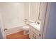 Bathroom features white shower tub combination and modern sink at 936 Glynn Oaks Dr, Clarkston, GA 30021