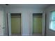Bright bedroom with open closets and window at 936 Glynn Oaks Dr, Clarkston, GA 30021