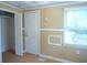 Cozy bedroom with neutral walls, a window, and a closet at 936 Glynn Oaks Dr, Clarkston, GA 30021