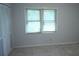 Bright bedroom with neutral walls, a window, and a closet at 936 Glynn Oaks Dr, Clarkston, GA 30021