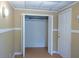 View of interior of closet with wood shelving at 936 Glynn Oaks Dr, Clarkston, GA 30021