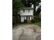 Charming two-story home with a brick front and a cracked driveway at 936 Glynn Oaks Dr, Clarkston, GA 30021