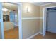 Hallway leading to stainless steel appliances and white cabinets at 936 Glynn Oaks Dr, Clarkston, GA 30021