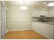 Bright kitchen features granite countertops and wood-look laminate flooring at 936 Glynn Oaks Dr, Clarkston, GA 30021