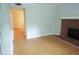 Bright living room featuring hardwood floors and a cozy brick fireplace at 936 Glynn Oaks Dr, Clarkston, GA 30021