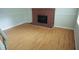 Bright living room featuring hardwood floors and a cozy brick fireplace at 936 Glynn Oaks Dr, Clarkston, GA 30021
