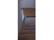 Carpeted stairs with wood handrail at 936 Glynn Oaks Dr, Clarkston, GA 30021