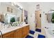 Bathroom featuring double sinks, a soaking tub, and neutral tones at 2080 Bankston Cir, Snellville, GA 30078