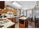 Traditional kitchen featuring wooden cabinetry, an island, stainless steel appliances, and a cozy breakfast nook area at 2080 Bankston Cir, Snellville, GA 30078