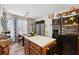 Bright kitchen featuring a center island, stainless steel refrigerator, breakfast nook and charming decor at 2080 Bankston Cir, Snellville, GA 30078