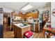 Charming kitchen with wood cabinets, center island, stainless steel appliances, and an adjacent breakfast nook area at 2080 Bankston Cir, Snellville, GA 30078