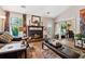 Cozy living room with fireplace, large window with lots of light, and stylish decor at 2080 Bankston Cir, Snellville, GA 30078