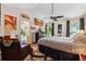 Spacious main bedroom featuring vaulted ceilings, accent walls, and a view into the ensuite bath at 2080 Bankston Cir, Snellville, GA 30078