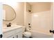 Bathroom featuring a single sink vanity, bathtub, and a mounted shower head at 269 Highway 11, Social Circle, GA 30025