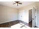 Bedroom with closet, fan, window and dark wood-look floors at 269 Highway 11, Social Circle, GA 30025