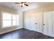 Bedroom showing double door closet, ceiling fan, and bright window at 269 Highway 11, Social Circle, GA 30025