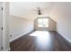 A bonus room boasts hardwood floors, a ceiling fan, and a window for natural light at 269 Highway 11, Social Circle, GA 30025