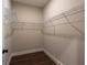 Walk-in closet with hardwood floors and wire shelving at 269 Highway 11, Social Circle, GA 30025