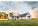 A charming two-story home with a landscaped yard and welcoming front porch is ready for your Gathering at 269 Highway 11, Social Circle, GA 30025