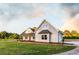 Beautiful two-story home with a spacious lawn and attached garage at 269 Highway 11, Social Circle, GA 30025