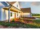 Inviting home featuring a covered porch and lush landscaping at 269 Highway 11, Social Circle, GA 30025