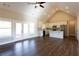 An open floor plan combines the living room and kitchen with stainless steel appliances and an island at 269 Highway 11, Social Circle, GA 30025