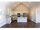 An island kitchen with stainless steel appliances, granite countertops, and modern cabinetry is a chef's dream at 269 Highway 11, Social Circle, GA 30025