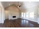 A spacious living room features hardwood floors, a brick fireplace, and French doors leading to the yard at 269 Highway 11, Social Circle, GA 30025