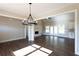 Bright living room with hardwood floors, a fireplace, and large windows at 269 Highway 11, Social Circle, GA 30025