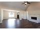 Open concept living room with hardwood floors, fireplace, and large windows at 269 Highway 11, Social Circle, GA 30025