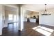 Open-concept living space featuring hardwood floors, fireplace, and adjoining kitchen at 269 Highway 11, Social Circle, GA 30025