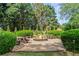 Backyard fire pit with wooden benches and gravel surround for a relaxing outdoor space at 4365 Wicklow Ct, Suwanee, GA 30024