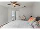 Bedroom with white walls, ceiling fan, and closet entrance at 4365 Wicklow Ct, Suwanee, GA 30024
