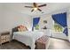 Cozy bedroom with ceiling fan and natural light at 4365 Wicklow Ct, Suwanee, GA 30024