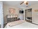Well-lit bedroom featuring closet, TV, and decorative drawers at 4365 Wicklow Ct, Suwanee, GA 30024