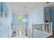 Bright foyer with a chandelier and a view of the front door from the second floor at 4365 Wicklow Ct, Suwanee, GA 30024